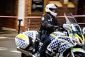 New South wales police riding a motorcycle.